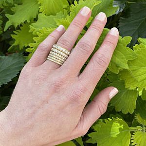 stack of micropave diamond wedding bands in different carat weights